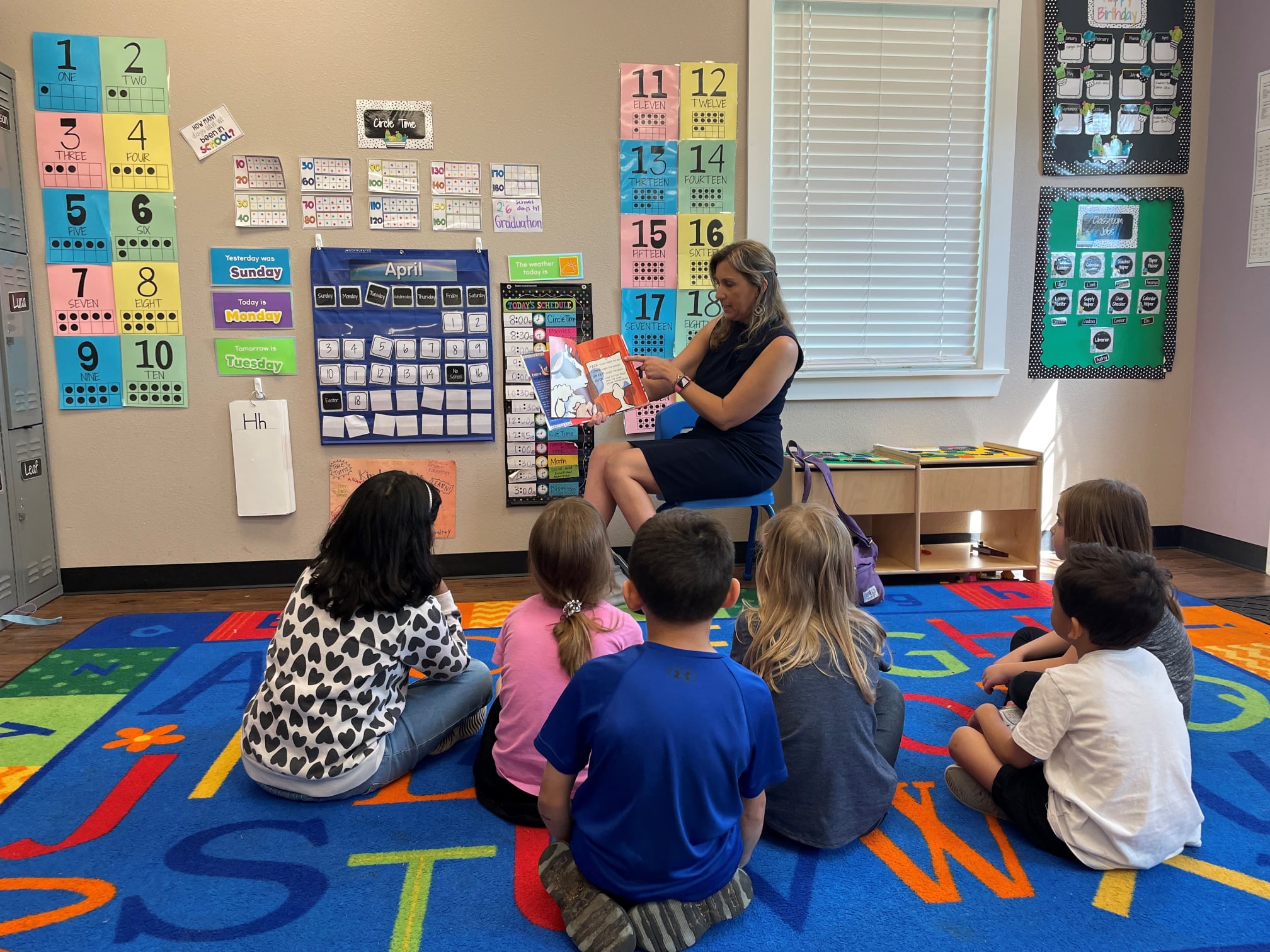 Mayor Christine DeLisle of Leander, TX reading to children in the community.